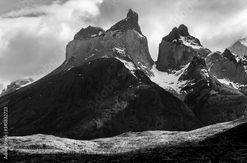 Black and white landscape of the Cuernos del Paine mountain peaks with vintage atmosphere, Torres del Paine national park, Patagonia, Chile.