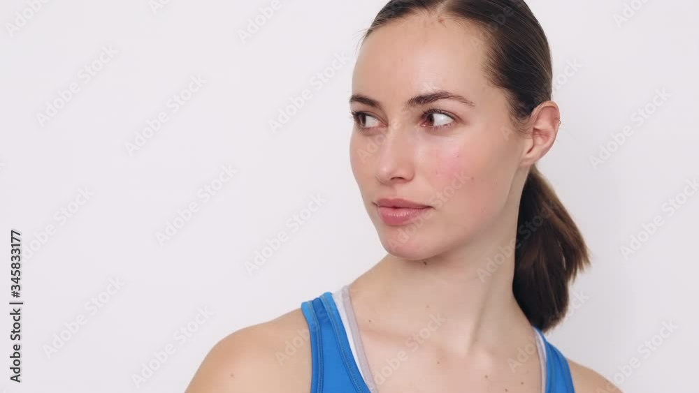 Close-up portrait of fit young woman looking focused and ready to do some serious workout Close-up portrait of fit young woman looking focused and ready to do some serious workout