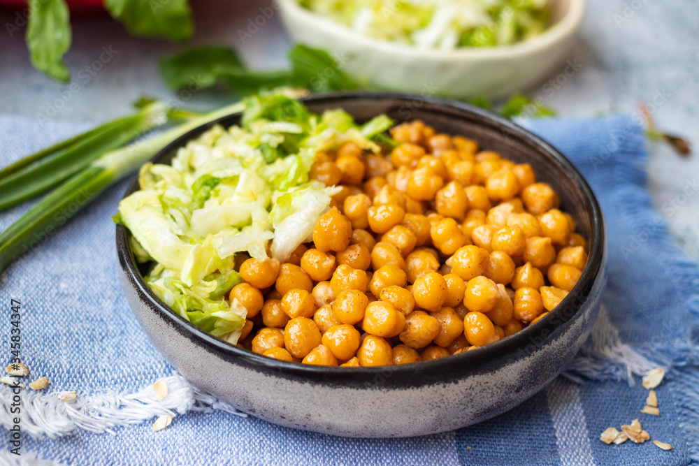 Cooked chickpea beans with vegetables salad. Vegan healthy food. Cooked chickpea beans with vegetables salad. Vegan healthy food.