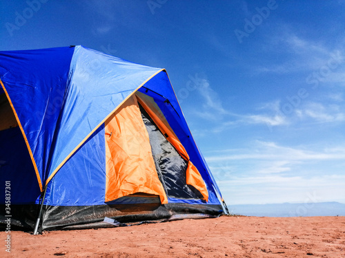 Tent on the mountain with blue sky. Camping in holiday