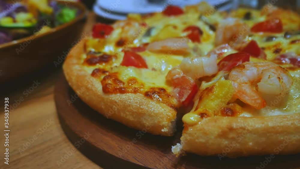 pizza and salad on the table at dinner time pizza and salad on the table at dinner time