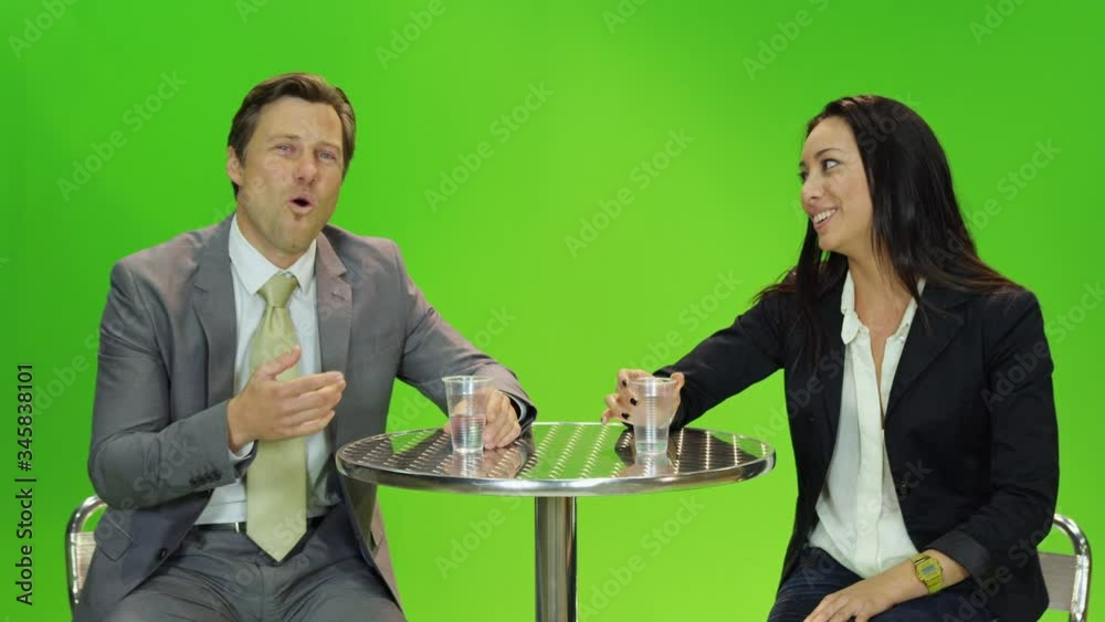 MS Presenter and guest talking in front of green screen in TV studio MS Presenter and guest talking in front of green screen in TV studio