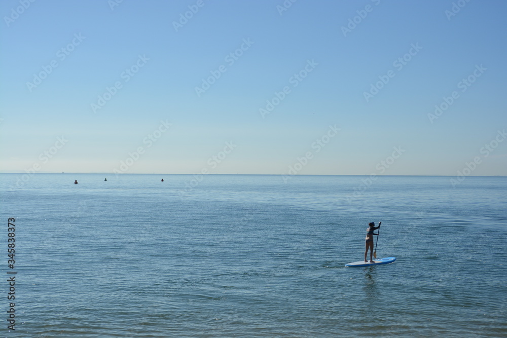 Calm ocean, paddle board