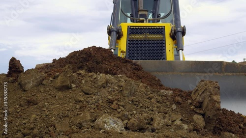 MS CU Front view of bulldozer leveling earth