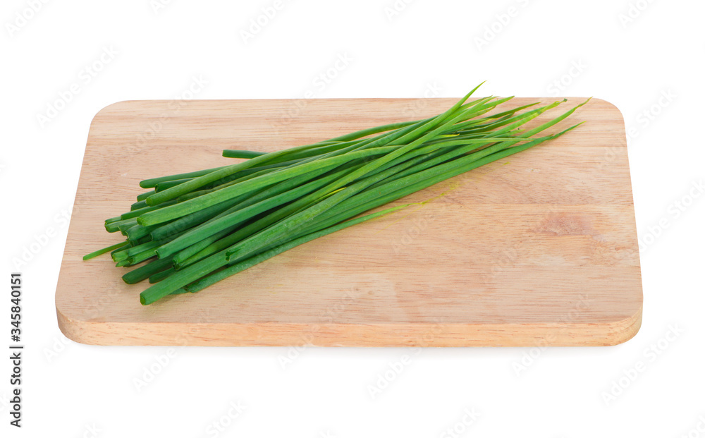 Fresh green onion isolated on the wooden board Fresh green onion isolated on the wooden board