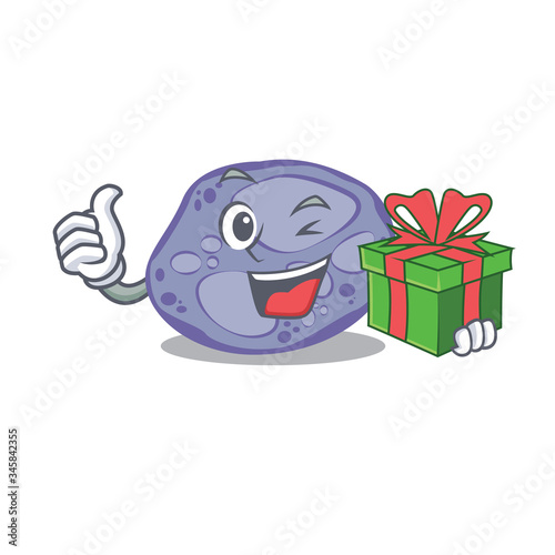 Smiling blue planctomycetes cartoon character having a green gift box