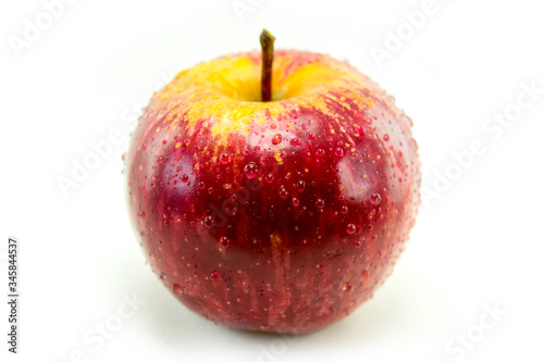 Isolated Apple on white closeup with Dew