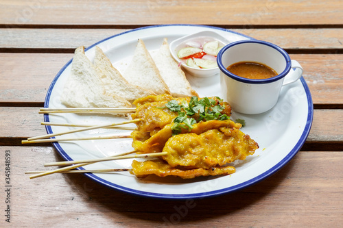 Pork satay - Grilled pork served with peanut sauce or sweet and sour sauce - Asian food style.
