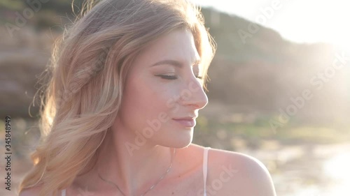 young woman at sunset at the warm evening