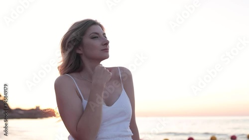 young woman at sunset at the warm evening