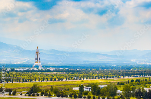 2 May 2020; Monument of Neutrality in Ashagabat, Turkmenistan on a bright cloudy day. photo