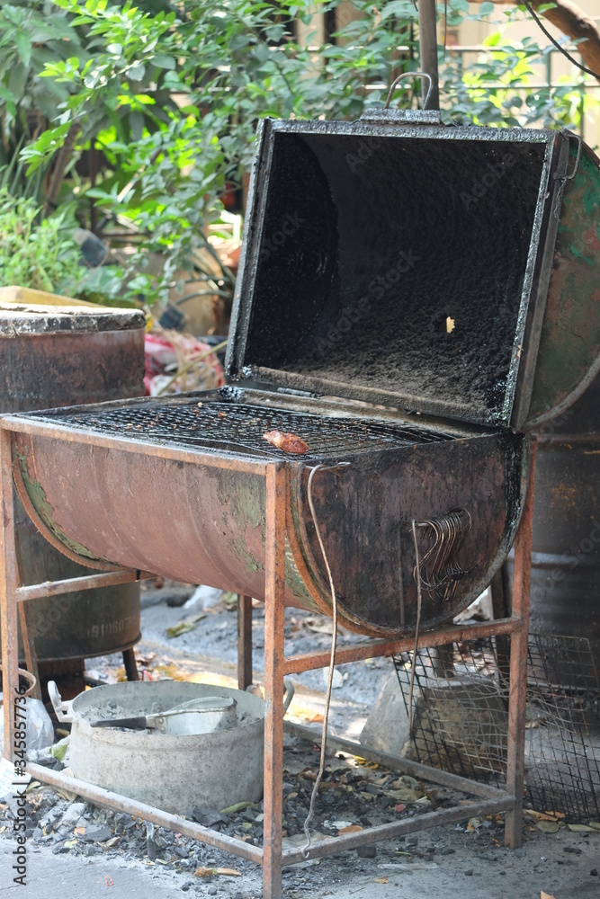 The old kitchen equipment of the restaurant on the sidewalk of the Thai people. The old kitchen equipment of the restaurant on the sidewalk of the Thai people.