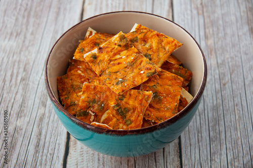 Homemade chips with cheese and herbs