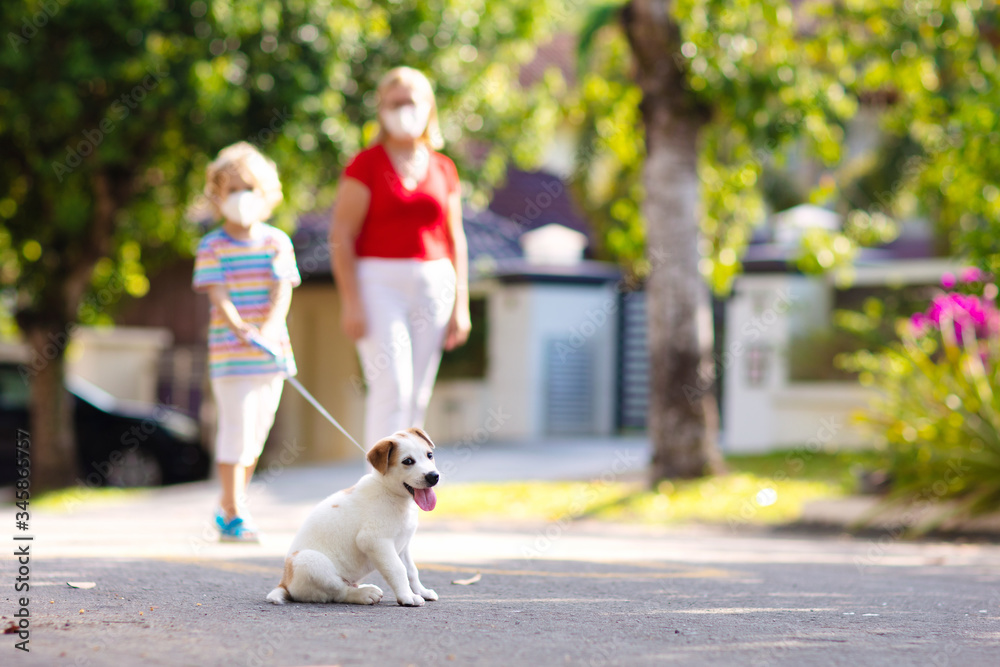 Fototapeta premium Family walking dog during virus outbreak