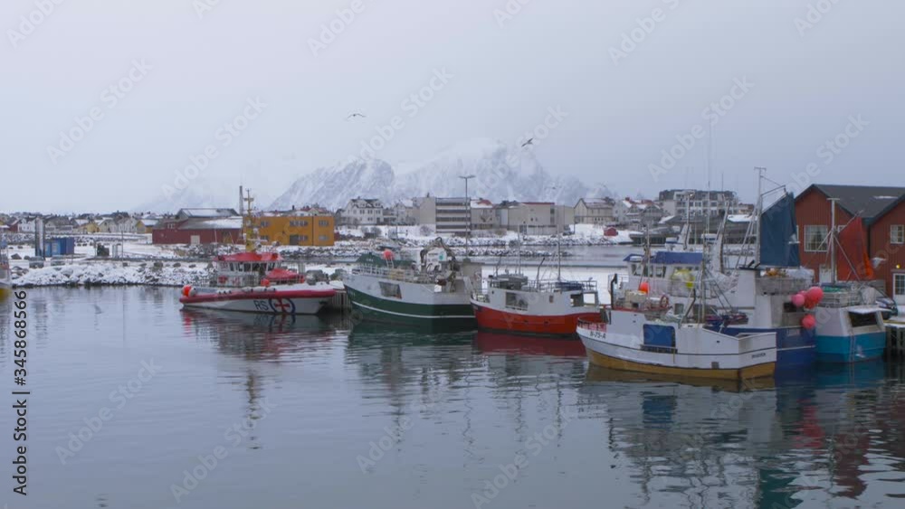 Fishing boats in a foggy morning at the dock in Andenes, Norway. Arctic Circle. Fishing boats in a foggy morning at the dock in Andenes, Norway. Arctic Circle.