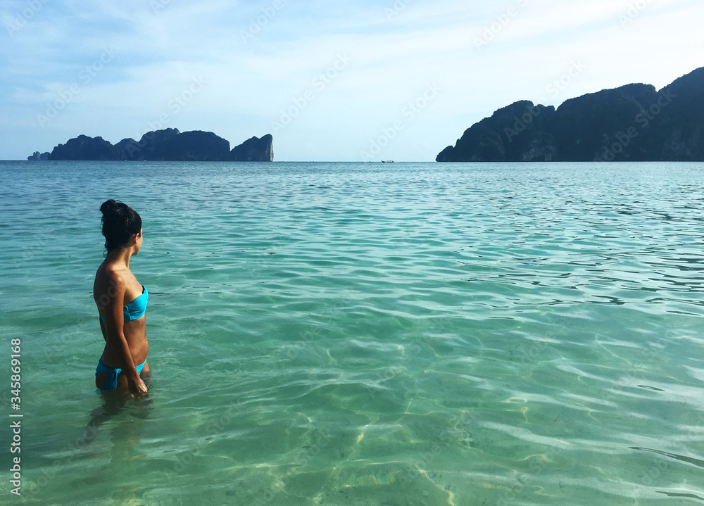 woman in bikini on paradise beach