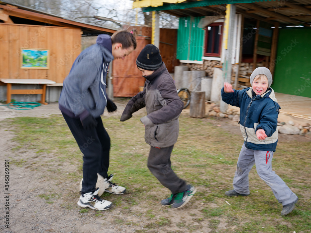 village children play soccer with ball on nature village children play soccer with ball on nature