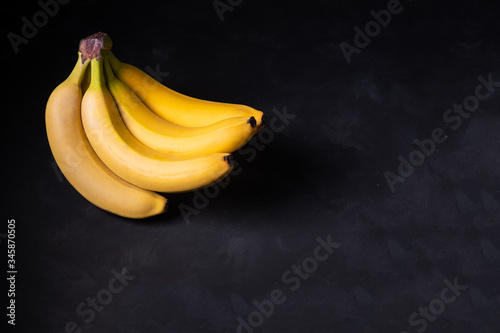 yellow bananas on a dark background