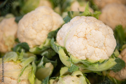 Fresh raw cauliflower sold on outdoor market. Farm seasonal spanish fruits and vegetables stock