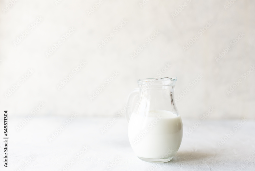 Glass jug and glass with milk Glass jug and glass with milk