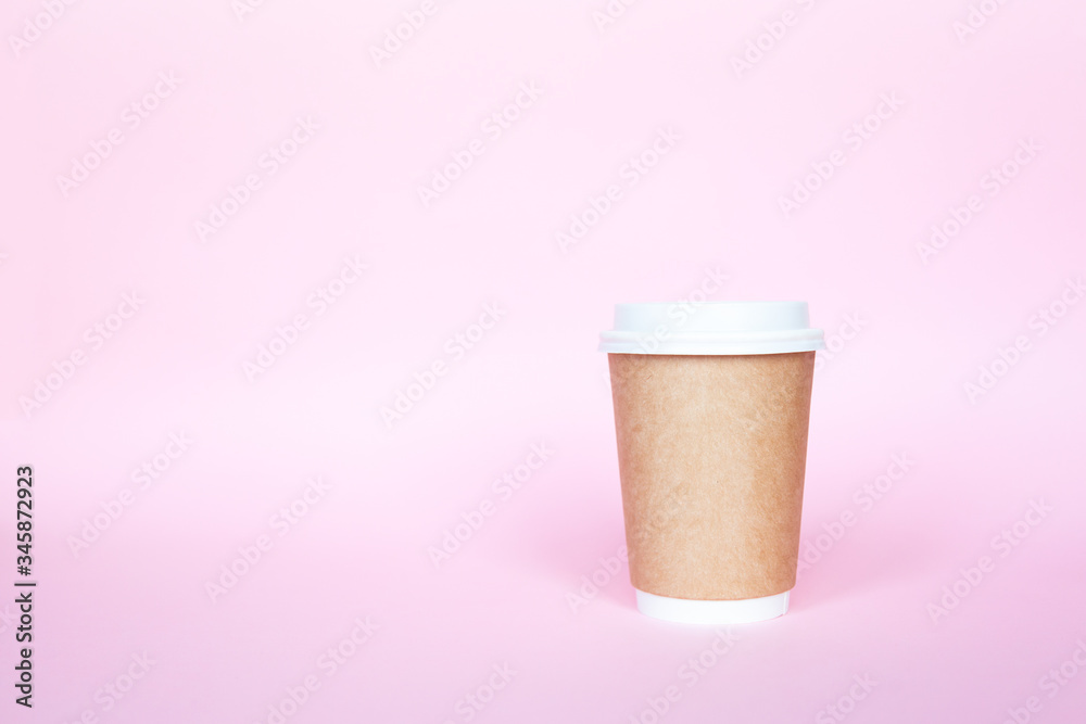 Set with disposable environmental paper utensils on pink background Set with disposable environmental paper utensils on pink background