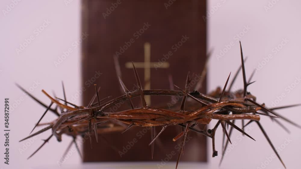 Close Up of Crown of Thorns Rotating with Bible in the Background Close Up of Crown of Thorns Rotating with Bible in the Background