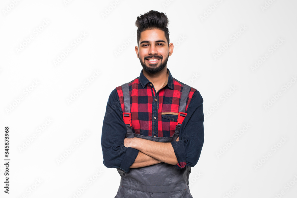 Fototapeta premium Portrait of smiling indian man worker in blue uniform isolated on white background