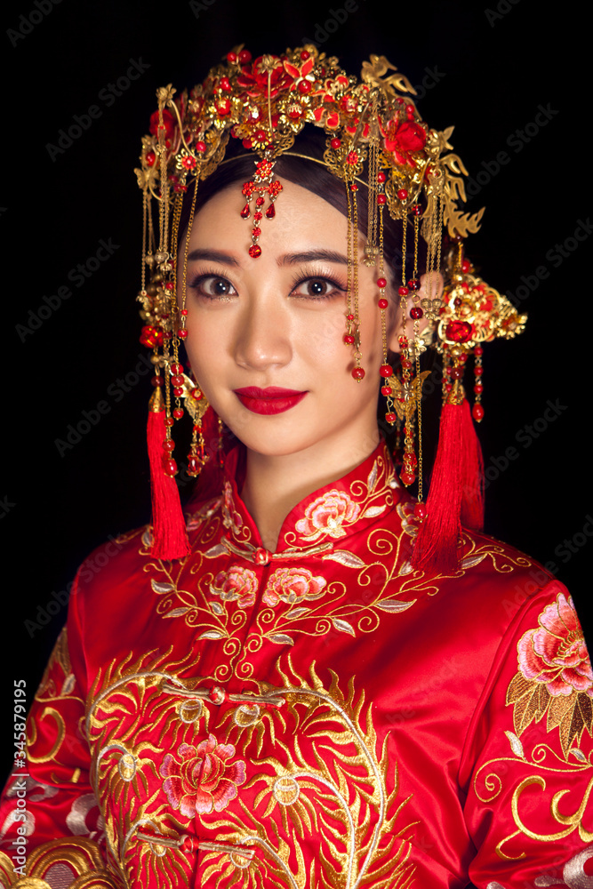 Portrait of wearing ancient Asian woman costume in black background