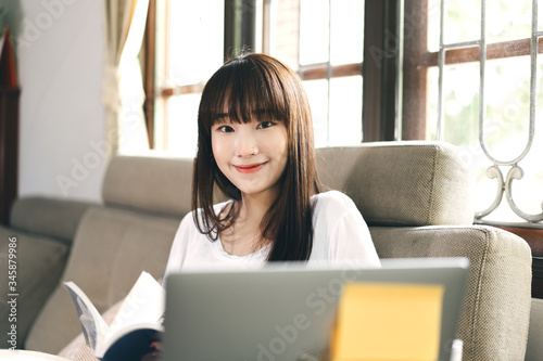 Asian happy smile teenager woman study online and stay at home.