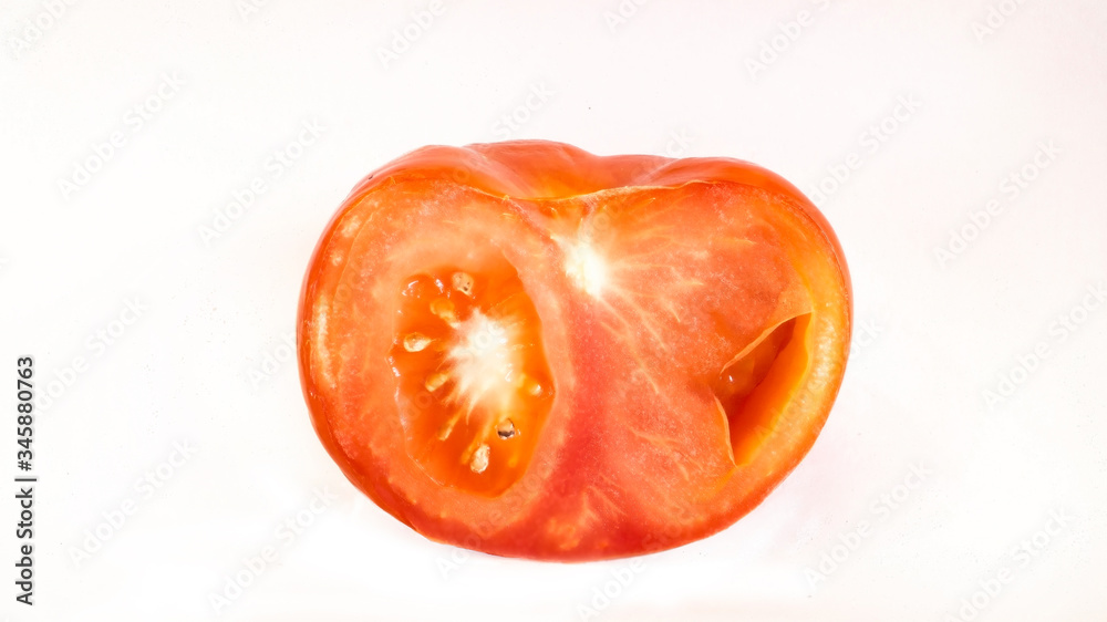 half of tomato isolated on a white background half of tomato isolated on a white background