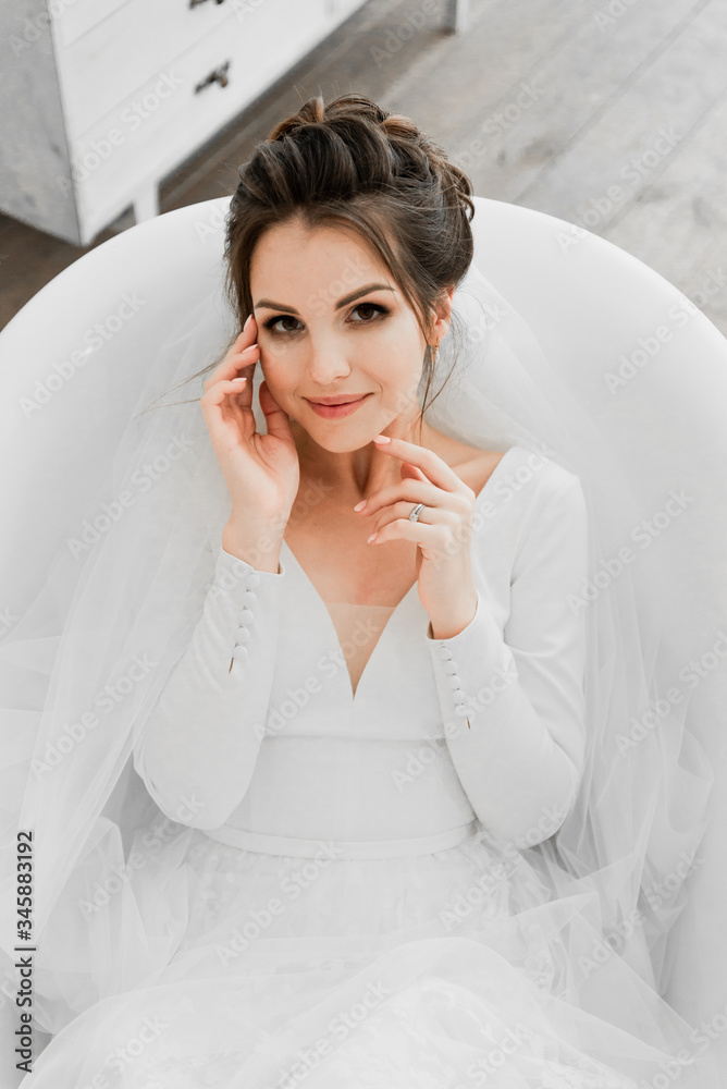 young bride lies in the bathroom,wedding day bride,beautiful girl in a wedding dress lies in a white bath,bride portrait,wedding photo shoot,Wedding Dress,bride touches face with hands young bride lies in the bathroom,wedding day bride,beautiful girl in a wedding dress lies in a white bath,bride portrait,wedding photo shoot,Wedding Dress,bride touches face with hands