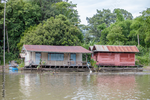 old wood house on water