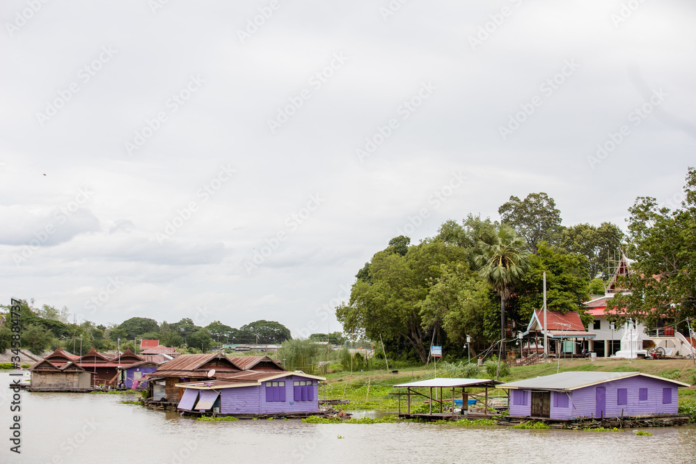 Naklejka premium thai red house beside near river