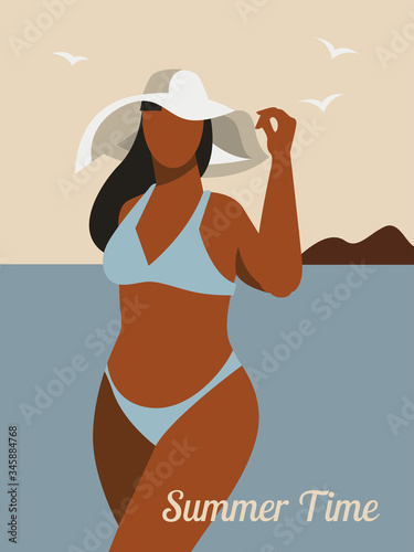 Plus size woman wearing a hat and swimsuit. Summertime and ocean
