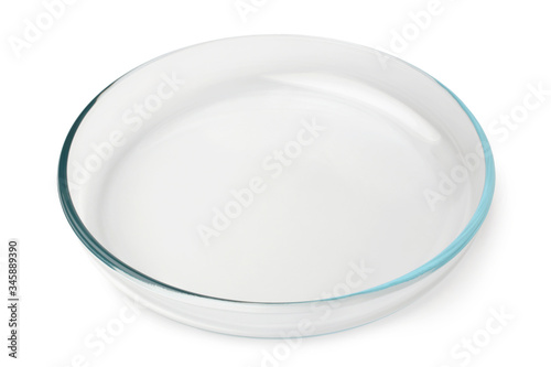 Round glass baking tray on white background