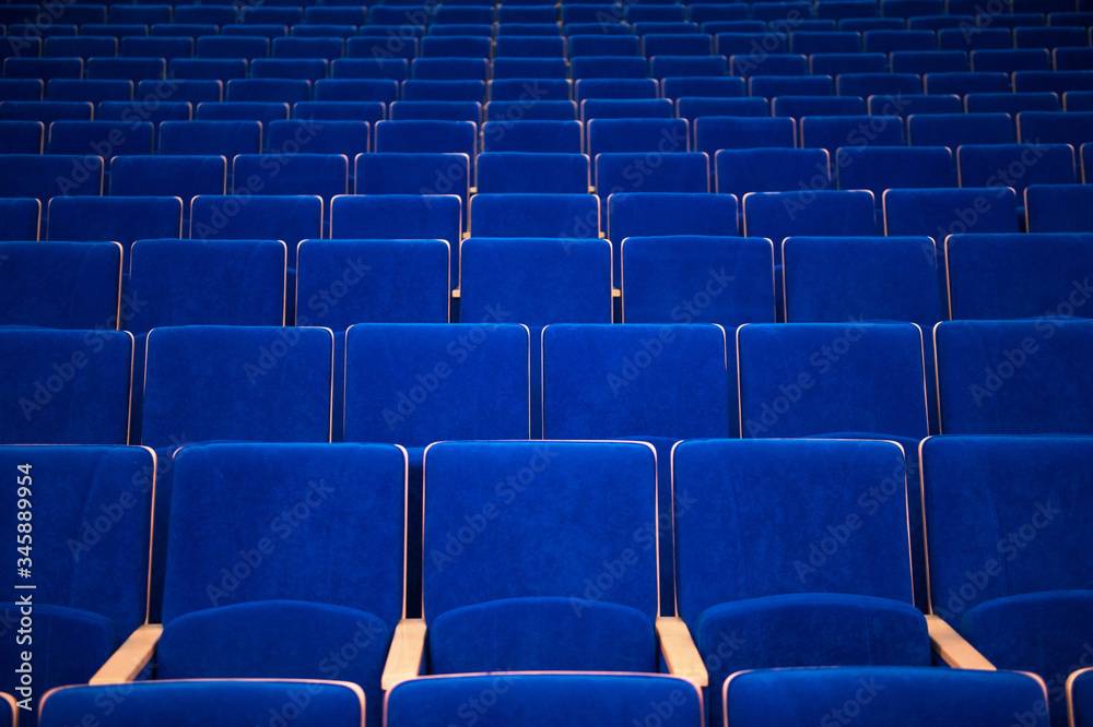 blue chairs in theatre with beige elbow-rest blue chairs in theatre with beige elbow-rest