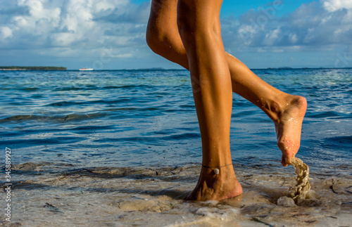 Woman legs walking on the beach © Monika