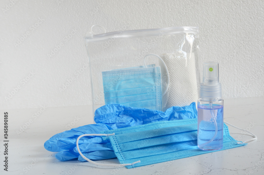 Set to exit to the street in terms of COVID-19 in the vacuum package. Medical gloves, medical mask, decontamination agent in a spray bottle. Set to exit to the street in terms of COVID-19 in the vacuum package. Medical gloves, medical mask, decontamination agent in a spray bottle.