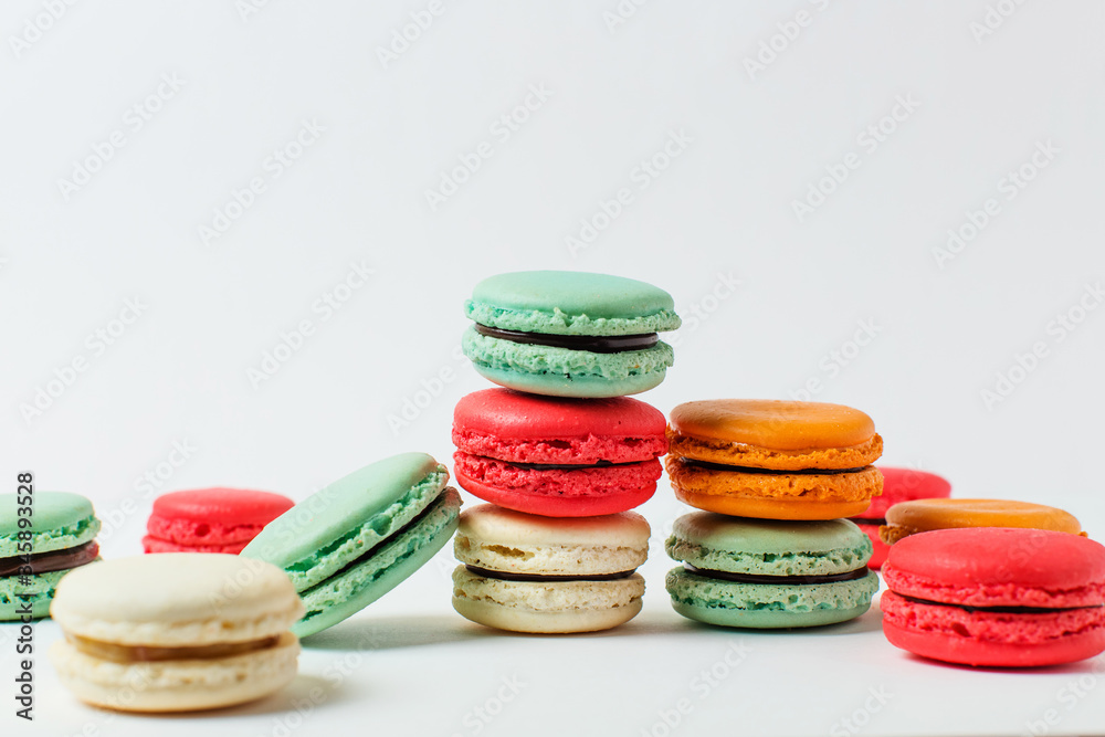 Beautiful colorful desserts. French macaroons on a white background Beautiful colorful desserts. French macaroons on a white background