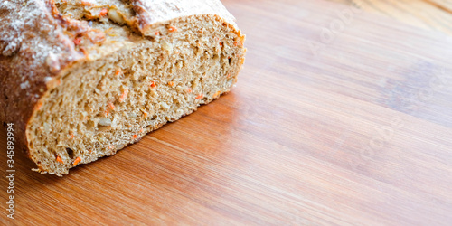 Bread on a cutting board. Warm photo. Place for text, banner