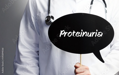 Proteinuria. Doctor in smock holds up speech bubble. The term Proteinuria is in the sign. Symbol of illness, health, medicine photo