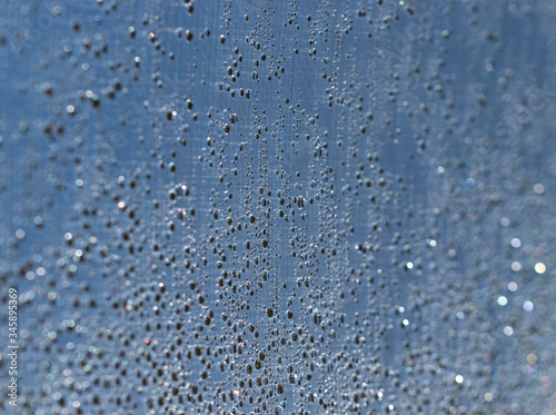 drops of water shine in the sun as a background