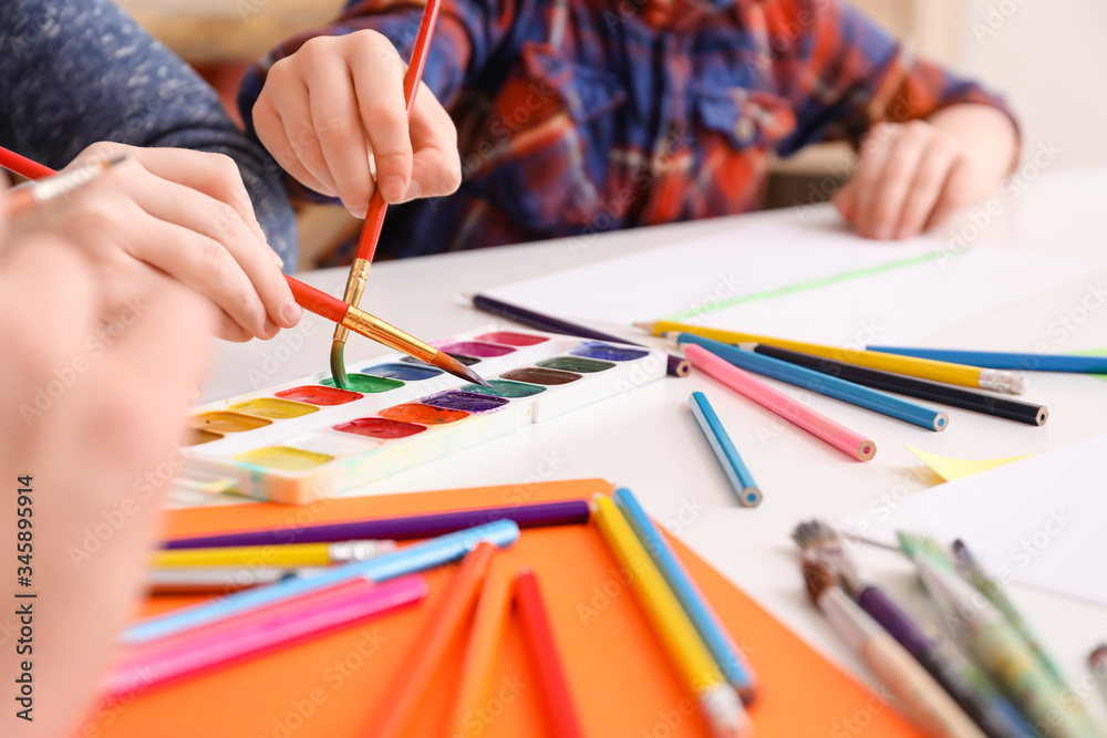 Drawing teacher giving private lessons at home, closeup Drawing teacher giving private lessons at home, closeup