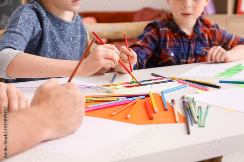Drawing teacher giving private lessons at home  closeup