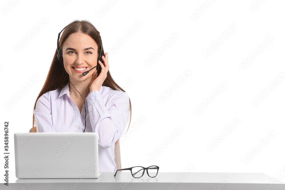 Beautiful young secretary at table on white background Beautiful young secretary at table on white background