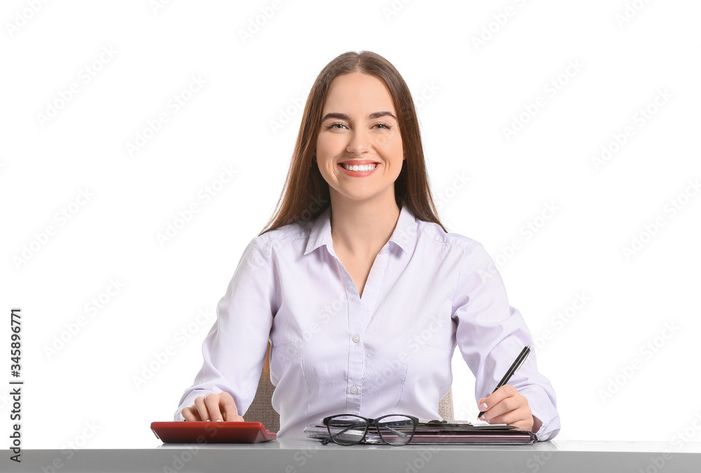 Beautiful young secretary at table on white background Beautiful young secretary at table on white background