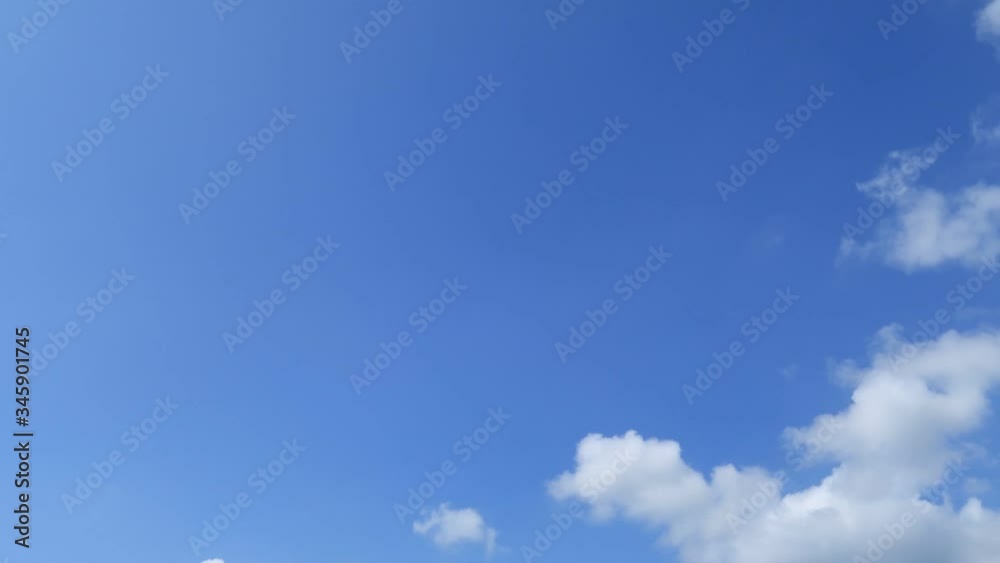 TimeLapse of Sunny blue sky with beautiful white cumulus clouds & cloudscape rolling on daylight horizon in tropical summer or spring sunlight & sun rays at daylight sunshine day, B-roll footage TimeLapse of Sunny blue sky with beautiful white cumulus clouds & cloudscape rolling on daylight horizon in tropical summer or spring sunlight & sun rays at daylight sunshine day, B-roll footage