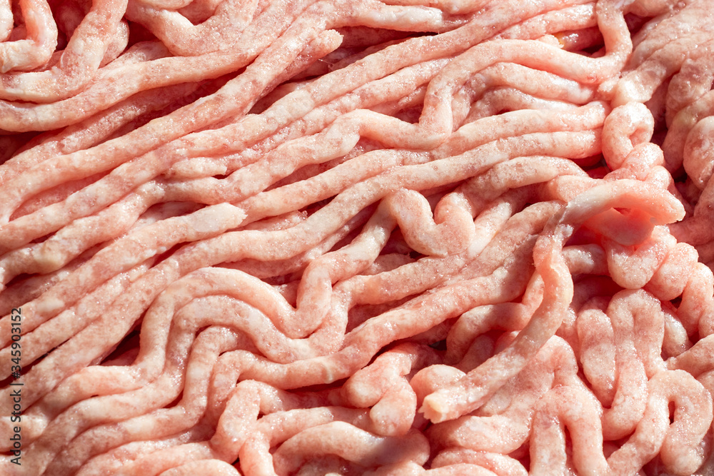 Raw Minced Meat (Beef) as detailed close-up shot, suitable as background with Space for text and texture Raw Minced Meat (Beef) as detailed close-up shot, suitable as background with Space for text and texture
