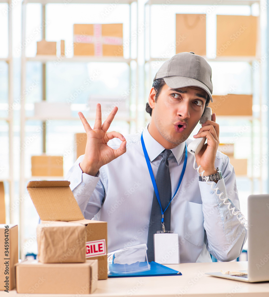 Male employee working in box delivery relocation service Male employee working in box delivery relocation service