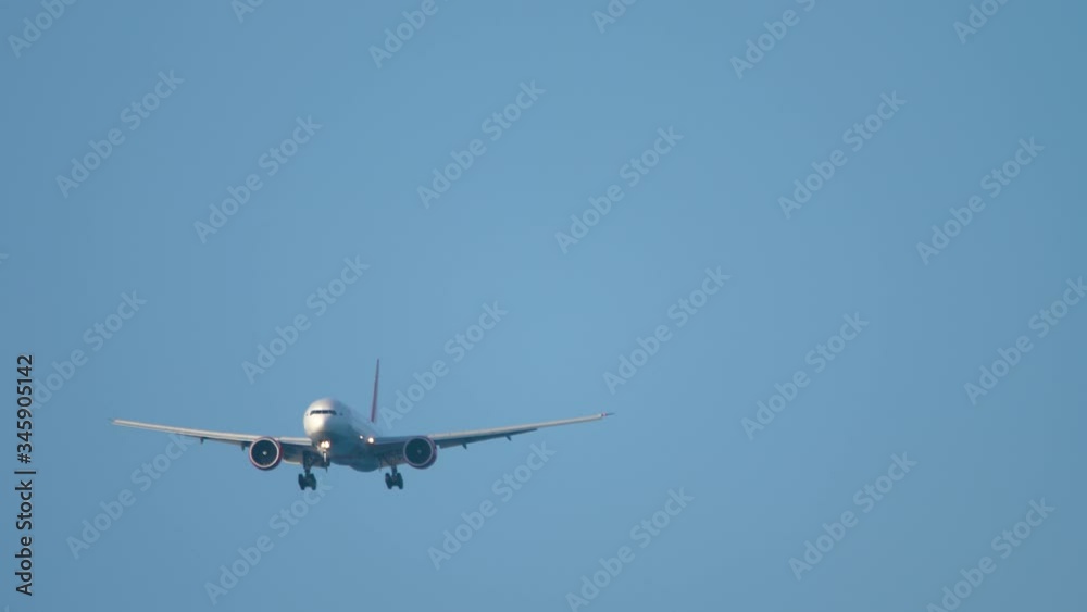 Widebody airplane approaching before landing Widebody airplane approaching before landing